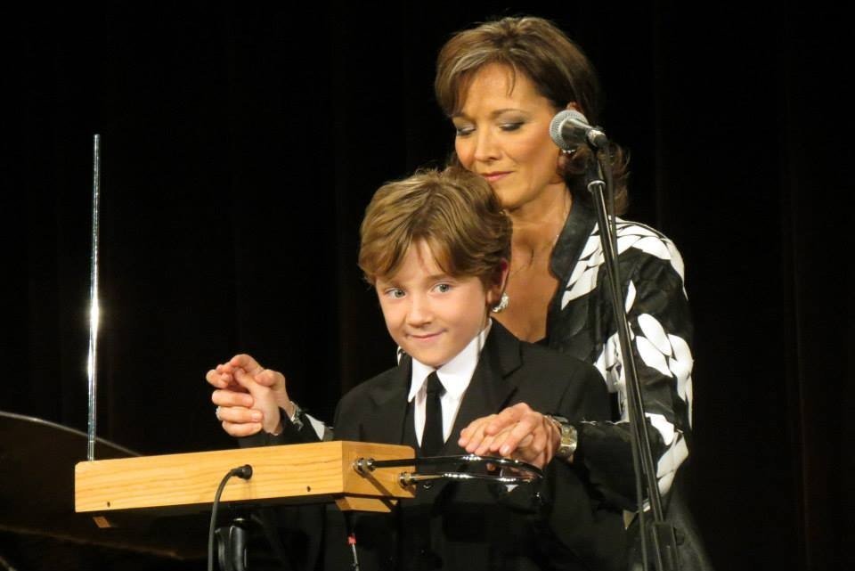 Hungarian thereminist Katica Illényi explaining to a child how to play theremin.